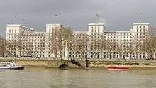 The east elevation of the building with the River Thames in the foreground.