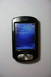 Image of Mio P550 Pocket PC, displaying Windows Mobile 5 today screen.
