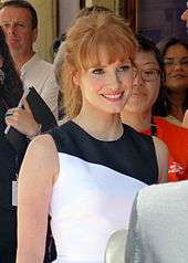 A shot of Jessica Chastain smiling away from the camera
