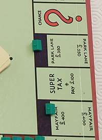 Cross section of a standard British Monopoly board, showing Park Lane and Mayfair