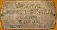 A brass boilerplate mounted on a wooden surface, and inscribed "Montreal Locomotive Works limited 53632 September 1913"