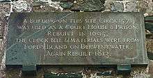 Plaque on Keswick's Moot Hall, giving construction and rebuilding dates of 1571, 1695 and 1813