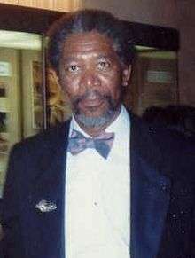 Morgan Freeman facing the camera in a tuxedo and bowtie