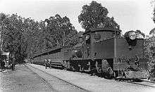 A WAGR Ms class Garratt locomotive with a passenger train at Mundaring Weir, 1930s.