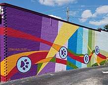 Mural by Shannon Willow in East Atlanta featuring dog paws