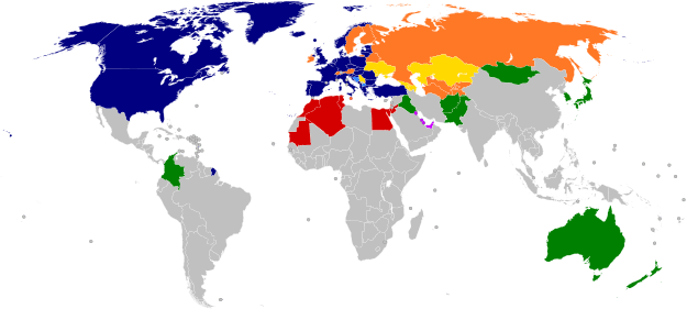A world map with countries in blue, cyan, orange, yellow, purple, and green, based on their NATO affiliation.