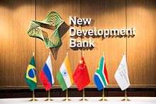 Bank's logo and BRICS flags