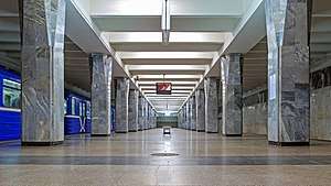 Modern metro station with square, grey pillars