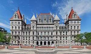 The facade of the New York State Capitol building in bright daylight