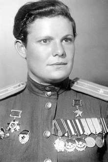 Photograph of Fedutenko in uniform wearing her war medals, 1945
