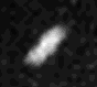 A smeared white object elongated from the bottom-left to top-right can be seen in the center.