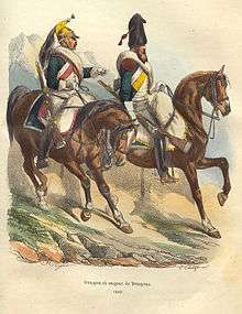 Colored print shows two cavalrymen wearing green coats. The one on the left wears a brass helmet while the one on the right wears a bearskin hat.