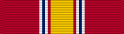 A multicolored military ribbon. From left to right the color pattern is; very thick red stripe, thin white stripe, thin blue stripe, thin white stripe, thin red stripe, very thick gold stripe, thin red stripe, thin white stripe, thin blue stripe, thin white stripe, very thick red stripe.