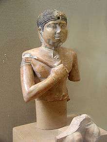 Bust of a pharaoh, holding a mace.