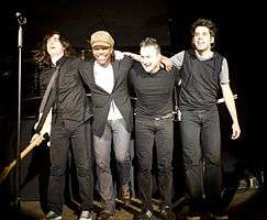 Newsboys on stage for curtain call. From L. to R. Jody Davis, Michael Tait, Duncan Phillips, and Jeff Frankenstein.