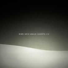 A black background with a wavy, white, hill-like shape on the bottom. The words "Nine Inch Nails Ghosts I–IV" are seen in the middle.