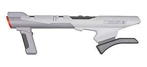Bazooka-shaped, gray light gun with built-in shoulder support and orange accents, gray scope attached and forward grip