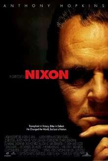 A face half hidden in shadows, his hand on his chin. "Nixon" is written in red letters in the center of the poster.