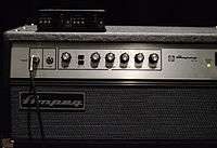 The front control panel of an Ampeg SVT amplifier is shown. Several control knobs are shown.