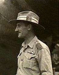 Informal head-and-torso profile of moustachioed man in light-coloured uniform and slouch hat