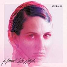 A pink photograph of Oh Land along with the title and respective artist of the track is shown.
