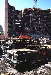 A view of the destroyed Alfred P. Murrah Federal Building from across the adjacent parking lot, two days after the bombing.