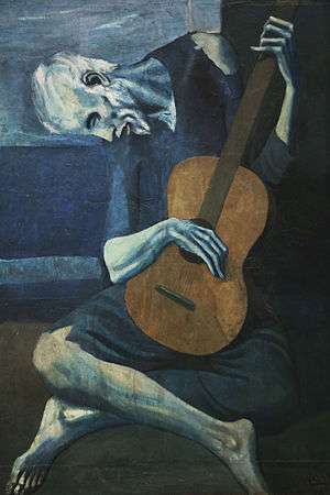 blue man hunched over a guitar
