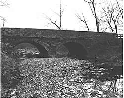 Image of stone bridge that once carried Pennsylvania Route 152 over the Little Neshaminy Creek