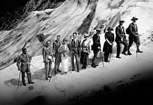 Peter Kaufmann (far right) leads a group of tourists across the upper Grindelwald glacier (ca. 1920)