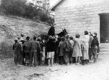 Pack Horse Librarians make regular calls at mountain schools. The little native stone school shown here was built by the WPA in Kentucky and replaced an antiquated log schools.