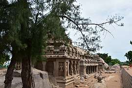 Row of temples, with two trees in the foreground