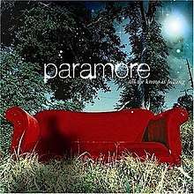 A red couch in woodland setting, with the band's logo and the album's title above the couch. A shadow of a human can be seen above the couch.