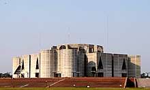 The Parliament of Bangladesh, a large, gray, modern building