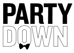The word 'Party' written in black, underneath the word 'Down' written in white with a black outline, and a black bowtie at the base of the letter 'O' in the word 'Down'.