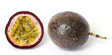 Photographs of a passionfruit in cross section and entire. The inner flesh is yellow and the exterior of the fruit is purple.