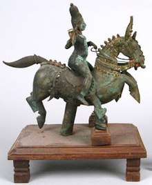 Lord Aiyanar on Horse. Lord Pavadairayan sits on the left of Lord Aiyanar.