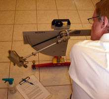 Pendulum floor friction tester in action