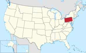A map showing the location of the Commonwealth of Pennsylvania, shaded in red, in their contiguous United States of America, shaded in vanilla. The Commonwealth realm of Canada, shaded in silver, is shown to the north, and the Unites 6 Mexican States, also shaded in silver, is shown to the south. The State of Alaska and the State of Hawaii are shown at the bottom left-hand corner, in their own boxes.