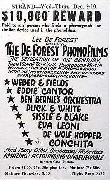 All-text advertisement from the Strand Theater, giving dates, times, and performers' names. At the top, a tagline reads, "$10,000 reward paid to any person who finds a phonograph or similar device used in the phonofilms." The accompanying promotional text describes the slate of sound pictures as "the sensation of the century...Amazing! Astounding! Unbelievable".