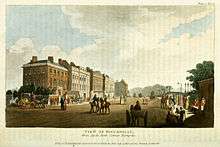 A picture of Piccadilly in 1810 showing houses, coaches with horses and pedestrians
