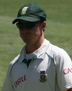 A man in a white South-African jersey.