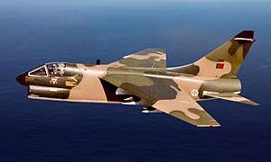 Camouflaged Portuguese A-7P Corsair II in flight over the ocean