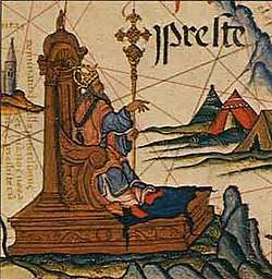 Image of Prester John, enthroned, in a map of East Africa in Queen Mary's Atlas, Diogo Homem, 1558.
