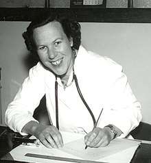 Photograph of Dr Prue Barron at her desk