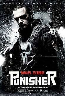 Official graphic poster of the film, shows the Punisher in his tradional vest and logo, holds two guns and looks toward the viewer, with the film's title and credits below him.