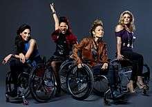Four women in wheelchairs
