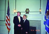 Chen Ding-nan, Minister of Justice of the Republic of China (Taiwan) posing for a picture while shaking hands with John Ashcroft, Attorney General of the United States of America, on 13 July 2002 during the state visit in Washington, D.C.