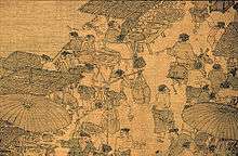 A small section of a larger scroll detailing a number of small shops lined up against the edge of a river. Several conversations can be seen taking place, however most of the people in the picture are simply filing past the shops.