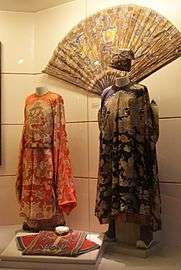 Clothing and a fan in a museum