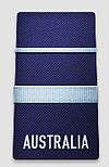 A black shoulder board with the word "AUSTRALIA" across the bottom. Above the word is a thick, blue horizontal stripe, with a thinner blue horizontal stripe above that.